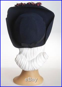 1940s Unique Shaped Navy Felt Hat with Curved Halo Brim Enhanced by Wine Florals