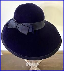 Stylish navy blue Halston designer wool felt hat, wide front brim, circa 1970's