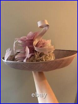 Very large lilac vintage woman's hat with magnificent decoration. Brand Giovannio