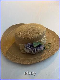 Vintage beige straw hat with ribbon and purple flowers made in China 1910