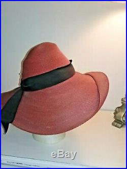 Vintage late 1930's, early 1940's wide brim straw hat with flowers. Garfinkle Co