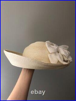 Vintage woman's beige hat decorated with white bow. Brand George Zamau'l, Straw