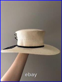 Vintage woman's beige hat with a black decor. Brand Chapeau Creations, Straw