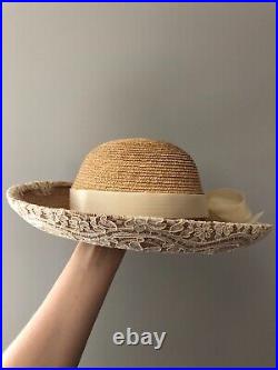 Vintage woman's beige hat with a bow and brooch. Brand Frank Olive, Straw