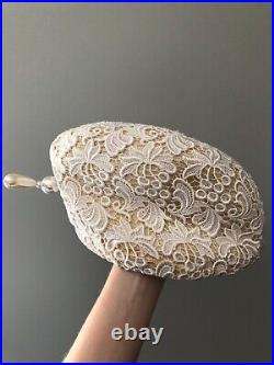 Vintage woman's beige hat with a white lace and brooch. Brand Jack McConnell, Wool