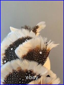 Vintage woman's beige hat with brown feathers and sequins. Brand Jack McConnel