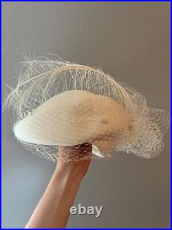 Vintage woman's beige hat with feathers. Brand Oscar de la Kenta, Wool