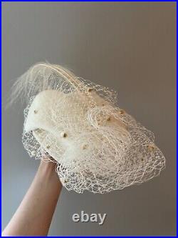 Vintage woman's beige hat with feathers. Brand Oscar de la Kenta, Wool