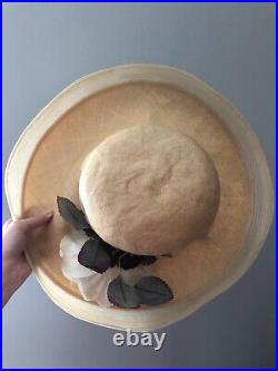 Vintage woman's beige hat with white flower and leaves. Brand Oscar de la Renta