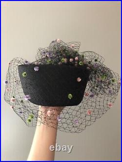 Vintage woman's black hat with a fine mesh and decor. Brand Chapeau Creations