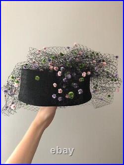 Vintage woman's black hat with a fine mesh and decor. Brand Chapeau Creations
