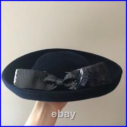 Vintage woman's black hat with bow and pin. Brand Mr. Kurt, Wool
