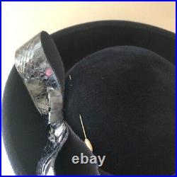 Vintage woman's black hat with bow and pin. Brand Mr. Kurt, Wool