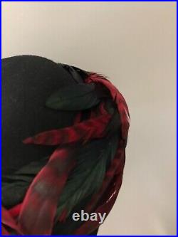 Vintage woman's black hat with colored feathers and sequins. Brand I. F. Y, Wool