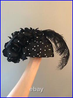 Vintage woman's black hat with feathers, roses and sequins. Brand Donna Vina