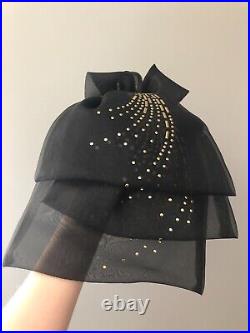 Vintage woman's black hat with gold decor and bow. Brand Jack McConnell, Straw