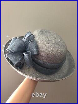 Vintage woman's blue hat with bow and decor. Brand Betmar, New York. Straw