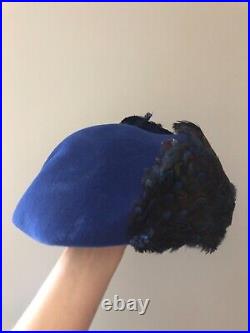 Vintage woman's blue hat with feathers and sequins. Brand Mr. John, Wool base