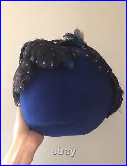 Vintage woman's blue hat with feathers and sequins. Brand Mr. John, Wool base