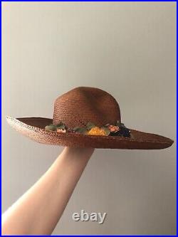 Vintage woman's brown hat with flowers and small bow. Brand Toucan, Straw