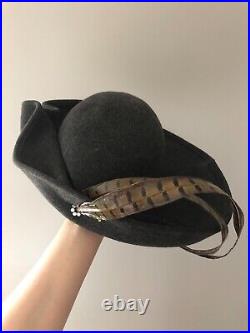 Vintage woman's gray unusually shaped hat with a feathers. Brand Mr. Kurt, Wool