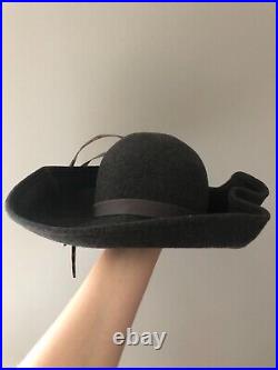 Vintage woman's gray unusually shaped hat with a feathers. Brand Mr. Kurt, Wool