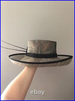 Vintage woman's green hat with a black flower. Brand Plaza Suite, Straw