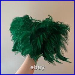 Vintage woman's green hat with feathers and bow. Wool base. Brand Jack McConnell