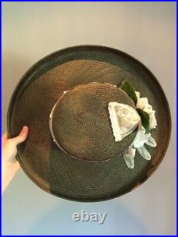 Vintage woman's green hat with flowers and a lace glove. Brand Sonni, Straw