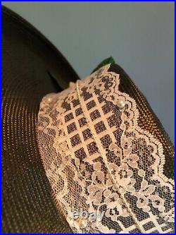 Vintage woman's green hat with flowers and a lace glove. Brand Sonni, Straw