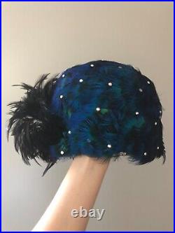 Vintage woman's hat with blue and black feathers and sequins. Brand Ann Dillon