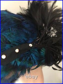 Vintage woman's hat with blue and black feathers and sequins. Brand Ann Dillon