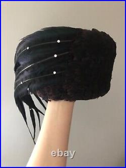 Vintage woman's hat with different types of feathers. Brand Jack McConnell