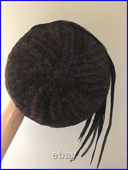 Vintage woman's hat with different types of feathers. Brand Jack McConnell