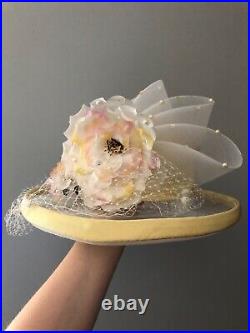 Vintage woman's hat with yellow ribbon and decor. Brand Whittall & Shon, Straw
