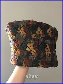 Vintage woman's multi-color deep hat with feathers. Brand Jack McConnell
