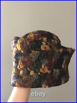 Vintage woman's multi-color deep hat with feathers. Brand Jack McConnell