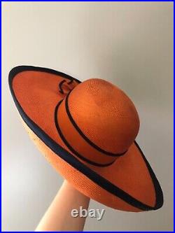 Vintage woman's orange hat with decor. Brand Chapeau Creations, Straw
