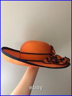 Vintage woman's orange hat with decor. Brand Chapeau Creations, Straw