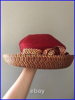 Vintage woman's red and gold hat with decor. Brand Carlos, Straw