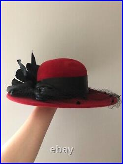 Vintage woman's red hat with a black leaves and ribbon, Wool. Brand Don Anderson