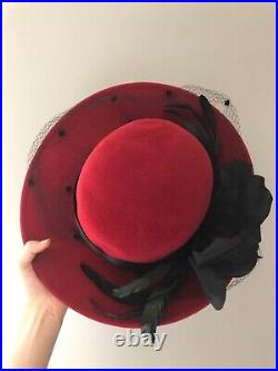 Vintage woman's red hat with a black leaves and ribbon, Wool. Brand Don Anderson