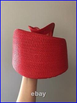 Vintage woman's red hat with a large decor and bow. Brand Jody J, Straw