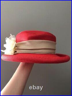 Vintage woman's red hat with a white flower. Brand Kates, Canada. Straw
