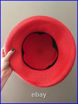 Vintage woman's red hat with a white flower. Brand Kates, Canada. Straw