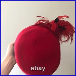 Vintage woman's red hat with red and black feathers. Brand Studio Kokin