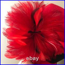 Vintage woman's red hat with red and black feathers. Brand Studio Kokin