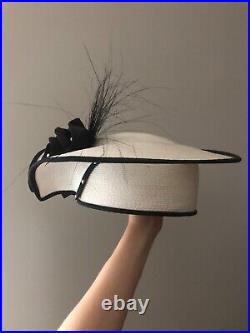 Vintage woman's white hat with a black rose. Brand Sylvia, St. Louis, Straw